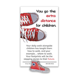 red sneaker lapel pin with extra distance message card